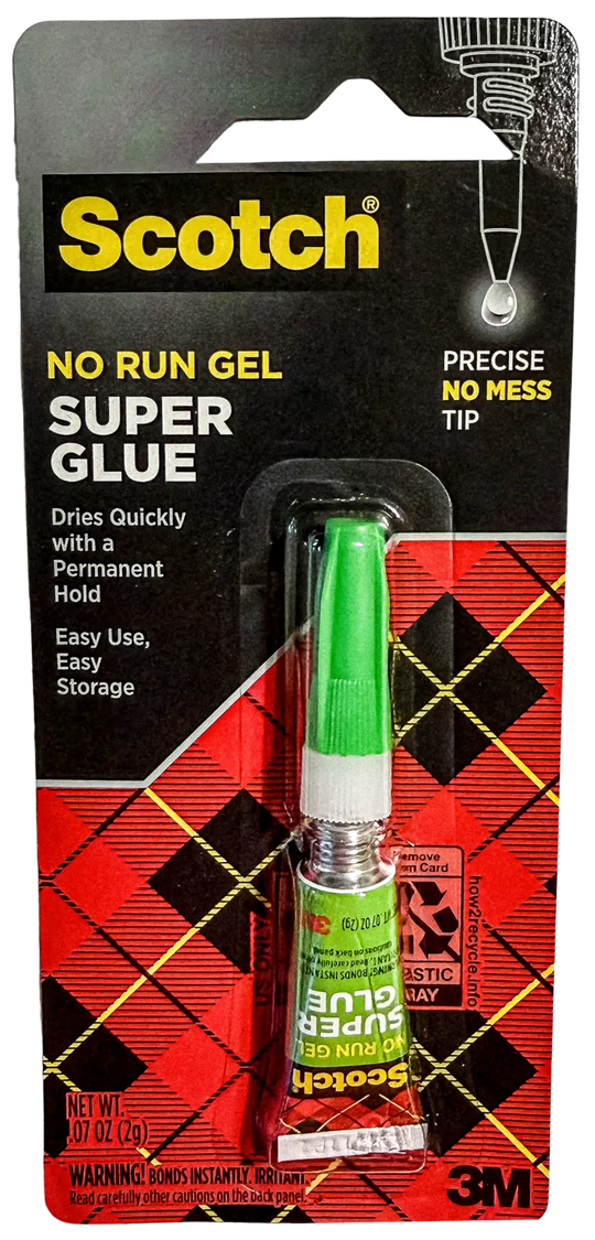 Scotch No Run Gel Super Glue in a 2 mL tube, packaged on a black and red card with a green applicator tip visible in a clear plastic window.